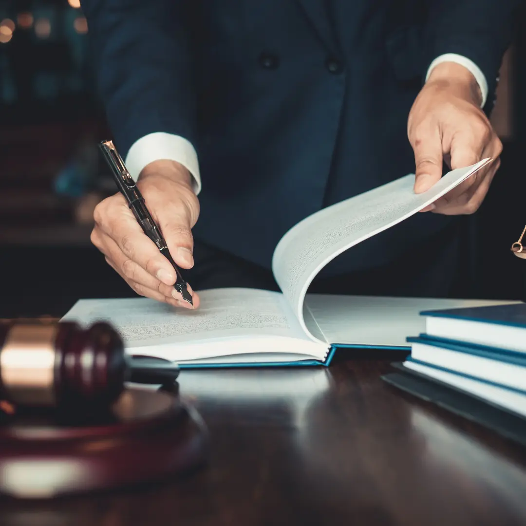 International criminal defense lawyer reviewing legal documents for extradition, INTERPOL, and cross-border criminal proceedings in Azerbaijan.